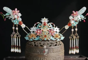 Complete Chinese Hanfu hair accessories set with central mountain pavilion headdress matching side hairpins floral ornaments pearl tassels and red bead details on black background