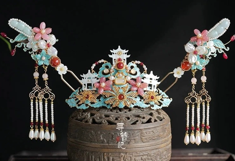 Complete Chinese Hanfu hair accessories set with central mountain pavilion headdress matching side hairpins floral ornaments pearl tassels and red bead details on black background