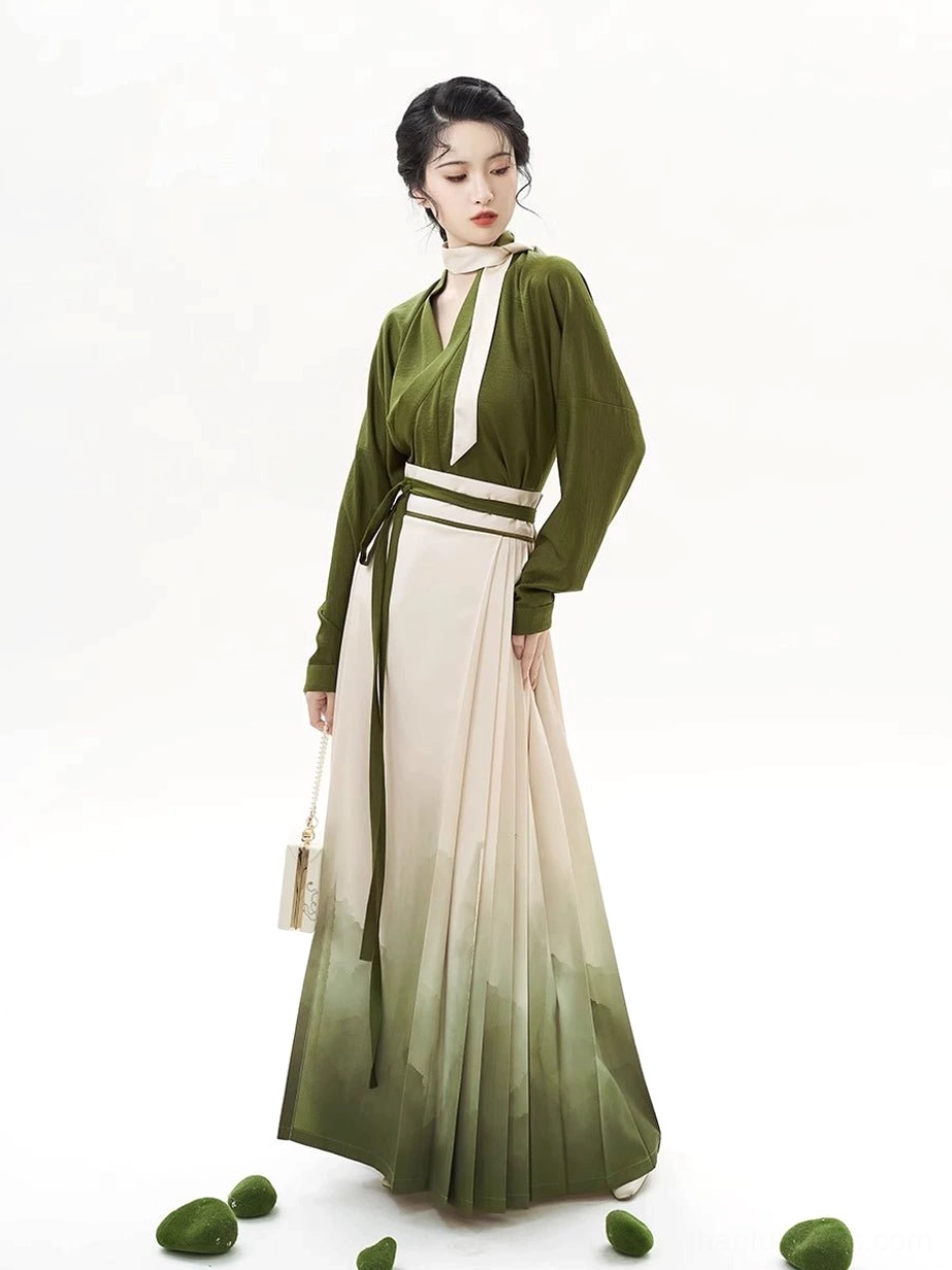 Full-length front view of the complete olive green Hanfu set with a flowing landscape-print mamian skirt and coordinated sash