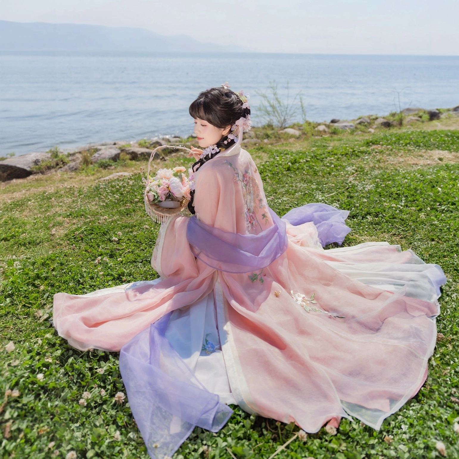 Complete pastel Tang Dynasty Qixiong Ruqun hanfu set with long flowing train and layered pink and purple sheer fabric