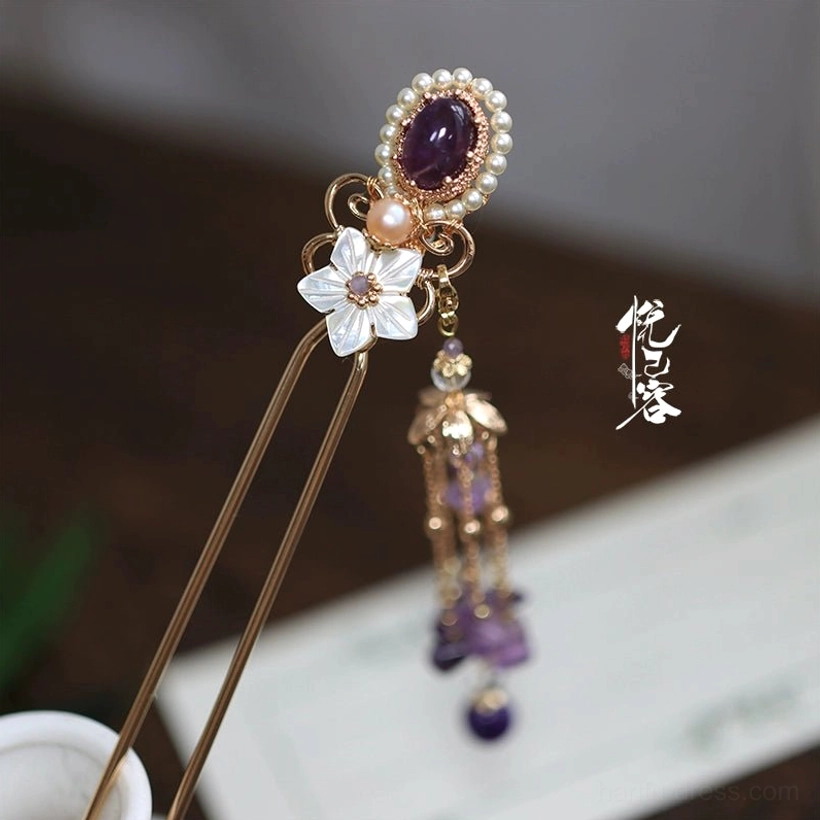 Complete Chinese purple tassel hair pin with oval gemstone pearl border shell flower charm and cascading ornament shown from the side