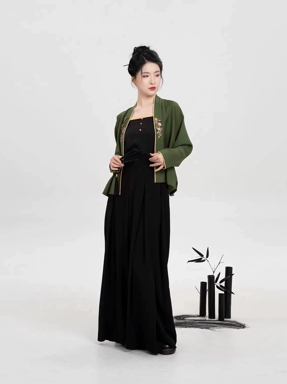 Complete Song Dynasty Hanfu suit with cropped olive green winged sleeve top and high waisted black pants front view