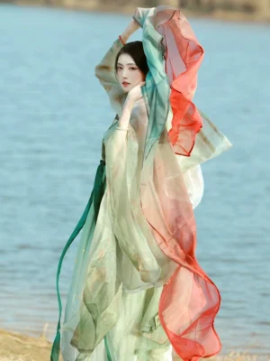 Complete Tang Dynasty Hanfu Heziqun set viewed from the side and back, featuring a flowing pale green skirt, sheer outer coat, waist sash, and layered traditional silhouette