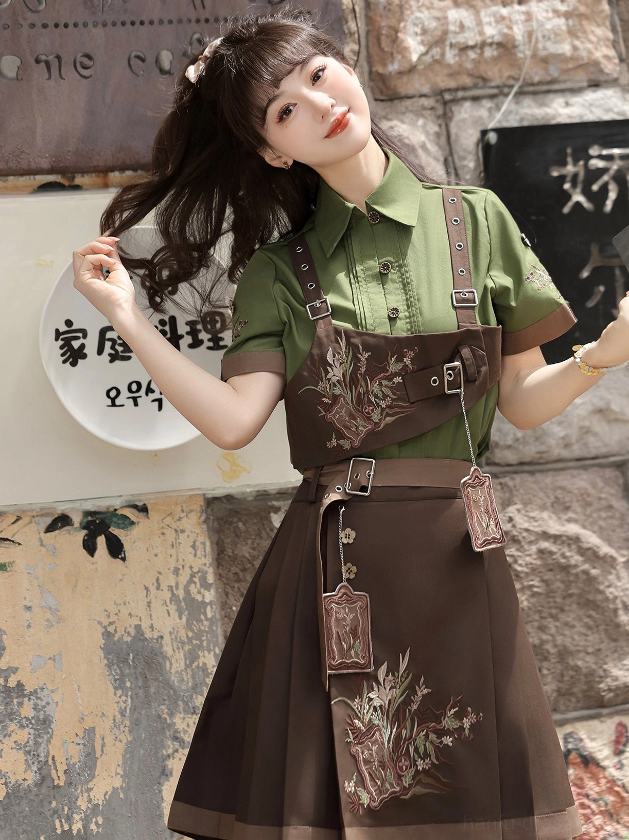 Side view of a contemporary Chinese hanfu fashion set showing the pleated mamianqun horse face skirt, plant embroidery, waist details, and hanging decorative tags