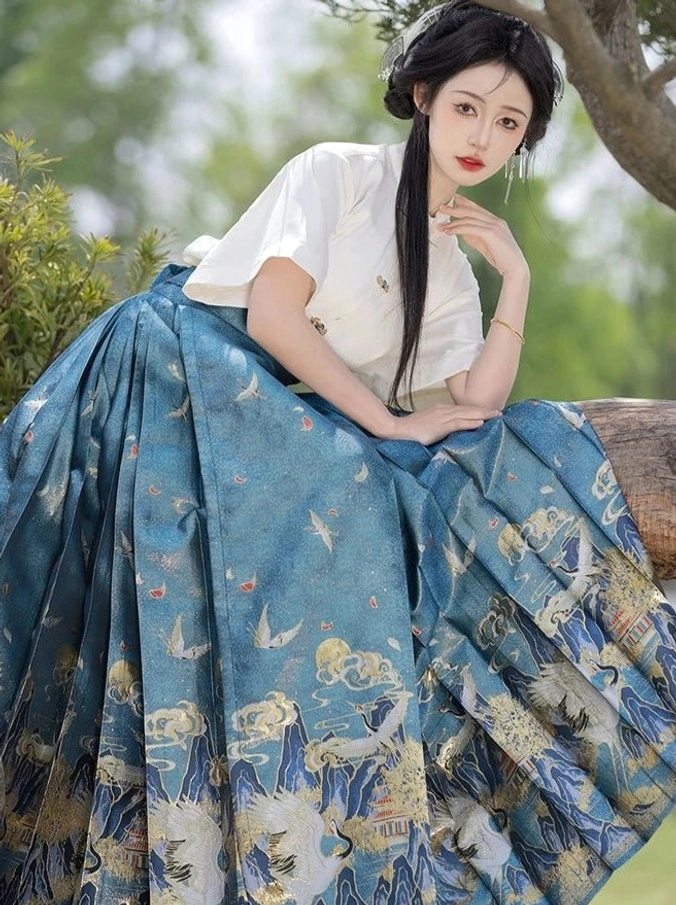 Blue Crane Returns Ming inspired mamianqun horse face skirt close view showing pleated crane cloud and mountain design