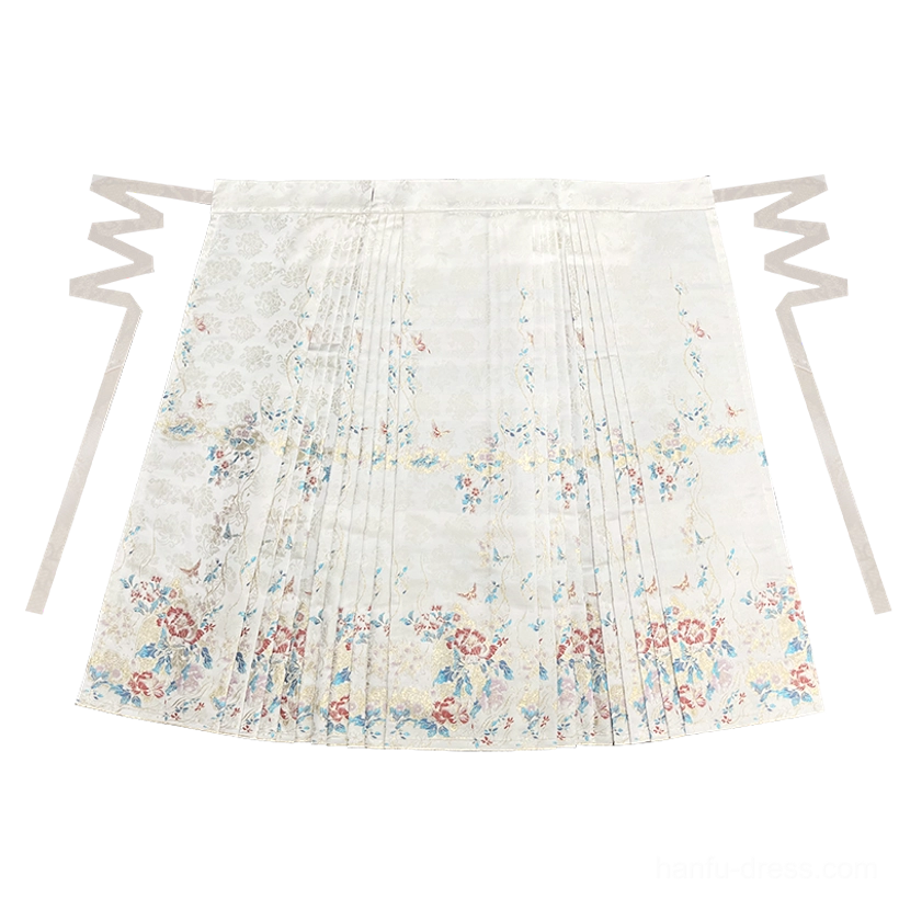 Flat lay view of a cream floral and bird print mamianqun horse face skirt with adjustable waist ties and structured pleats