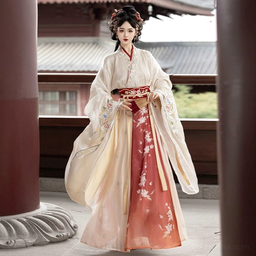Cream and red Wei Jin Dynasty Qiyao Ruqun Hanfu full front view with floral embroidered gradient skirt, decorative red waist belt, cross-collar top, and wide sleeves