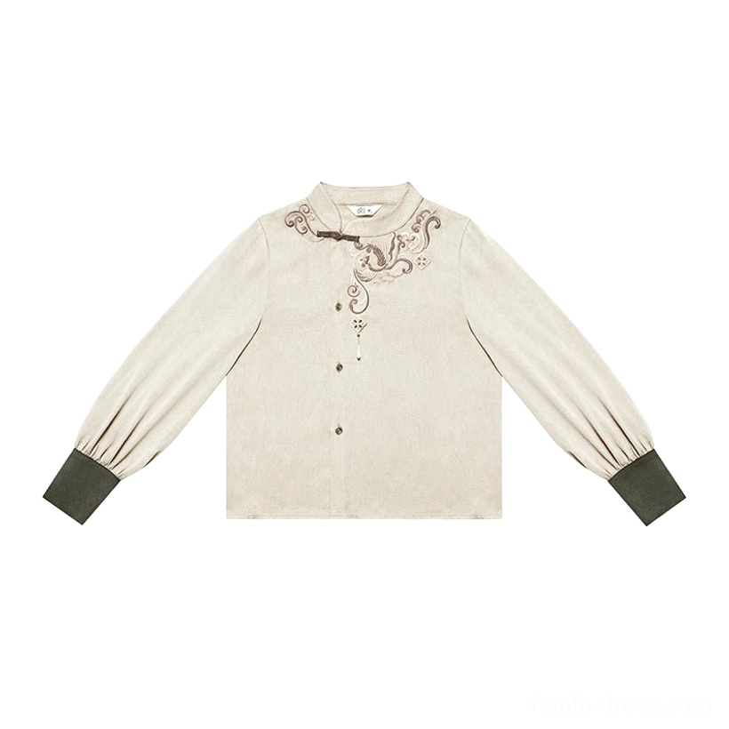 Flat lay of the cream beige stand-collar Hanfu inner blouse with embroidered neckline, lantern sleeves, and green cuffs