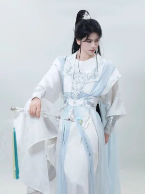 Close-up view of male hanfu for men with silver floral embroidery on the chest and cuffs, light blue chiffon layers, waist pendant chain, and Chinese sword
