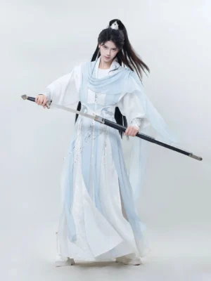 Full-length male Xianxia hanfu costume in white and light blue with layered chiffon panels, embroidered robe, waist decorations, and traditional Chinese sword