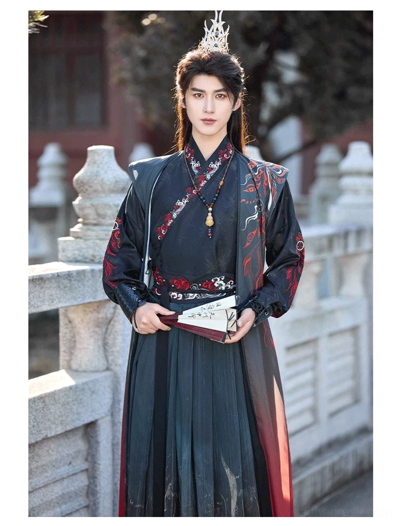 Detailed front view of Crimson Flame Wei-Jin cross-collar hanfu showing red collar embroidery, decorative waistband, dark teal upper garment, and structured outer vest