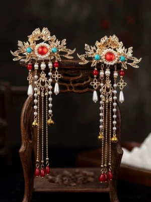 Pair of Crown Princess Hanfu side hair clips with gold floral settings red stones turquoise details pearl tassels red pendants and small bells
