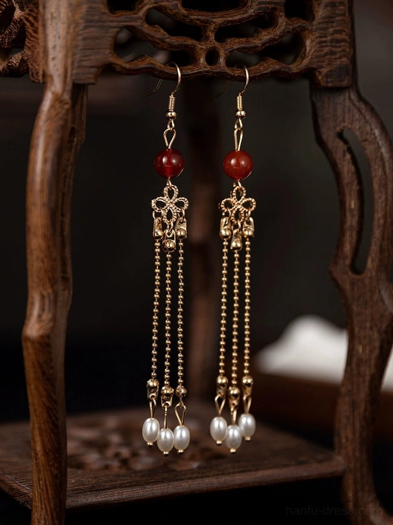 Chinese style Hanfu tassel earrings with gold chains red agate-style round pendants pearl drops and layered metal tassels