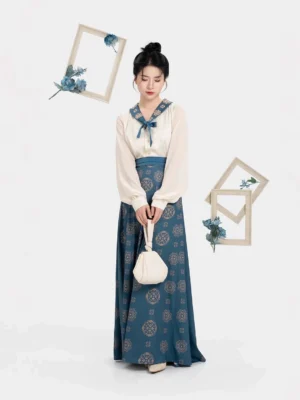 Full-length Dailan Tang Dynasty hanfu outfit featuring a cream blouse, flowing deep navy floral wrap skirt, golden accents, and modern traditional Chinese clothing styling