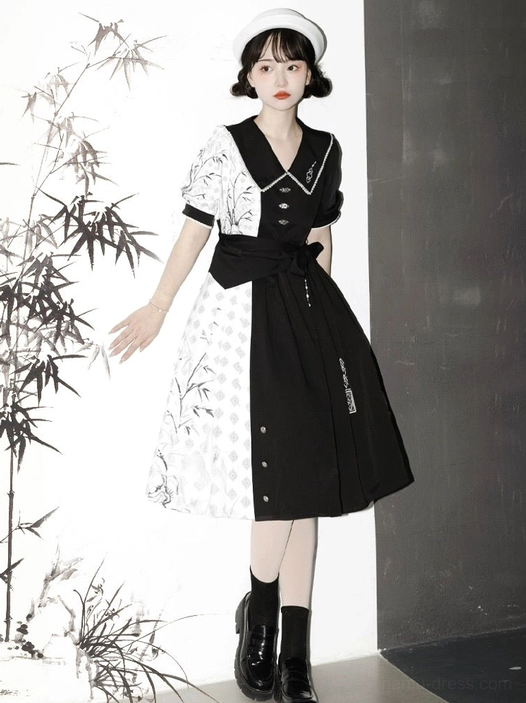 Full-body side view of black and white Modern Hanfu cheongsam dress with wide piped lapel, ink bamboo print, short puff sleeves, and embroidered waist belt