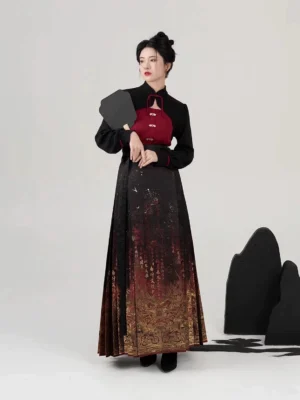Front view of Dansha Ming Dynasty Hanfu mamianqun set with black cropped stand-collar top, red camisole, gold printed skirt, and black folding fan