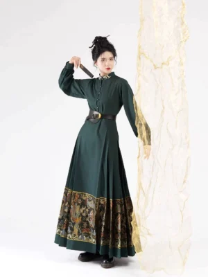 Three-quarter view of a dark green modern Ming Dynasty Hanfu horse face dress with buttoned front, lantern sleeves, leather belt, and ornate traditional Chinese skirt hem