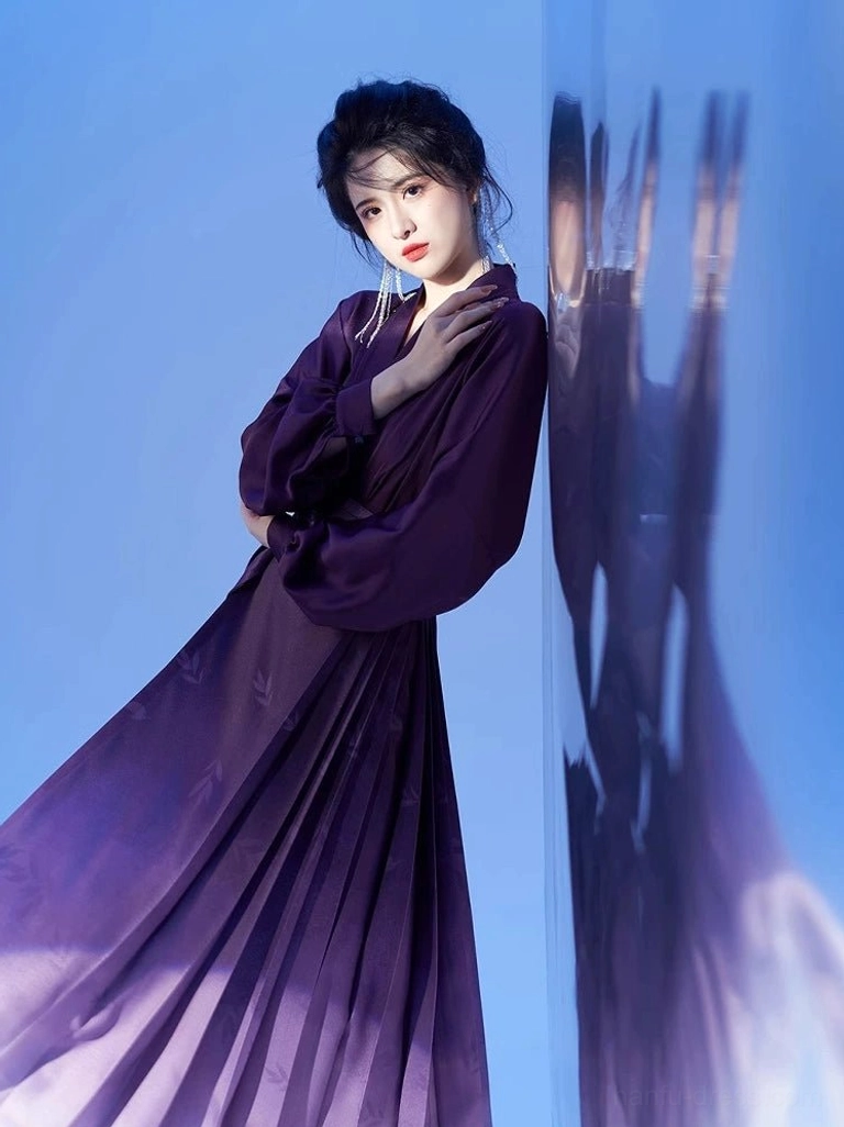 Half-body side view of dark purple cross-collar Hanfu top paired with a flowing purple to ivory ombre mamian skirt