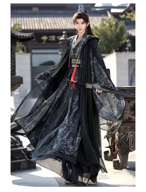 Front view of a dark Song-inspired hanfu for men and women featuring a hooded cape, embroidered waist belt, black printed inner robe, and layered traditional Chinese styling on temple stairs