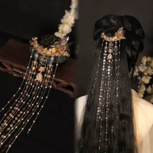 Gold-toned Chinese tassel hairpin displayed on stand and worn with a traditional Hanfu updo