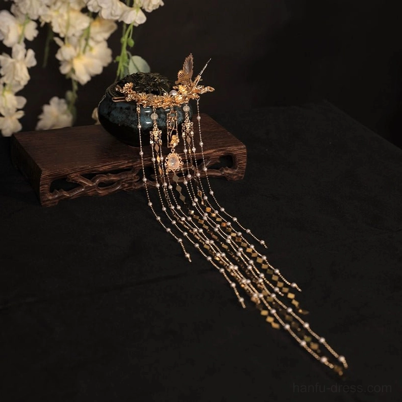Side overhead view of Dazzle Chinese hairpin with butterfly flower ornament pearl beads and long tassels