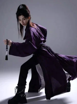 Deep purple Tang Dynasty bamboo Hanfu robe in a dynamic side pose, styled with black trousers and buckle boots