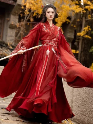 Deep red Wei Jin Dynasty Qiyao Ruqun Hanfu with embroidered robe, wide chiffon sleeves, pleated skirt, waist sash, tassels, and sword