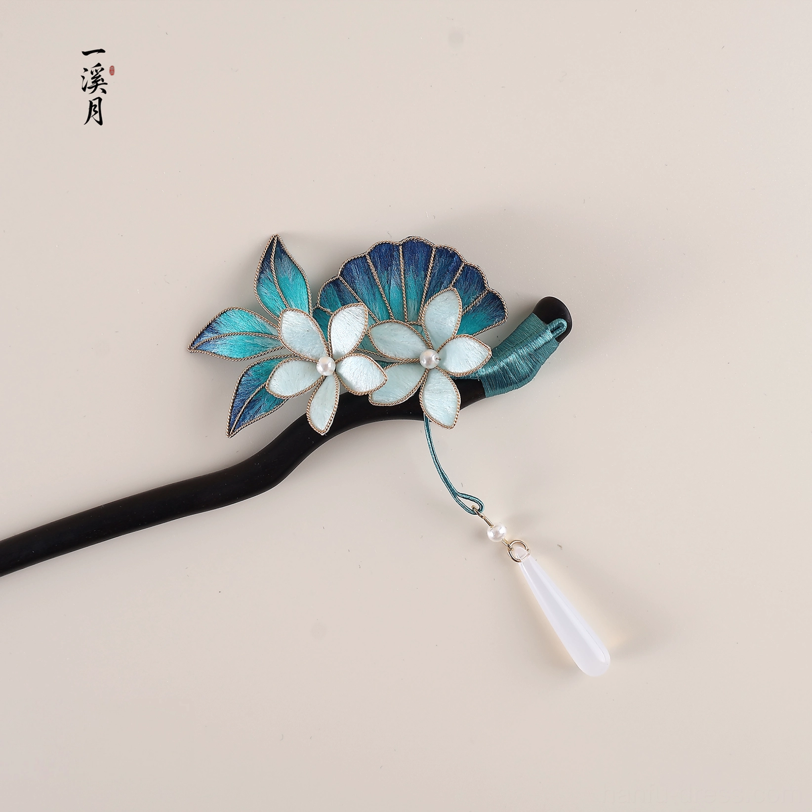 Deep sea floral Chinese hair stick with blue layered blossoms pearl details dark wooden pin and white teardrop tassel