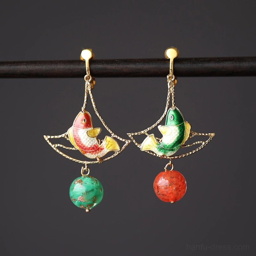 Koi fish drop earrings front view on a black display rod with gold ball-top clip-on closures, enamel-style carp charms, and colorful bead pendants