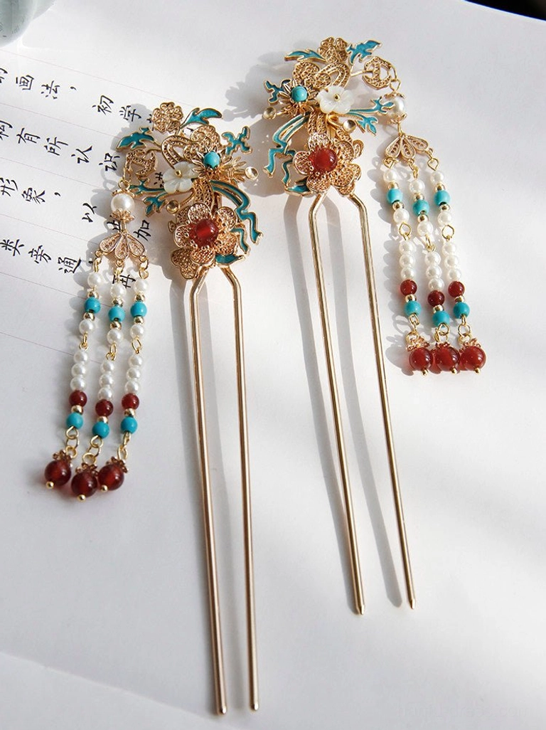 Pair of simple double-pronged Chinese hair sticks with gold-tone floral tops white pearl tassels red beads and blue bead accents