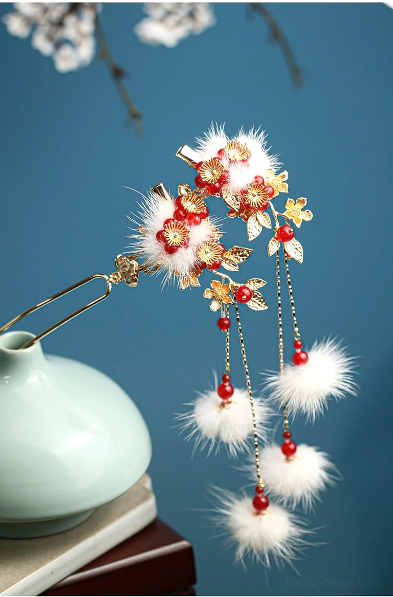 Matching double tassel Chinese plum blossom hair accessory with gold floral details, white pom-poms, red beads, and flowing fur tassels