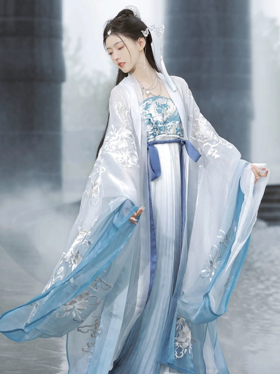 Dragon Queen blue Tang Dynasty Hanfu heziqun dress set shown in three-quarter side view with wide embroidered sleeves and flowing gradient skirt