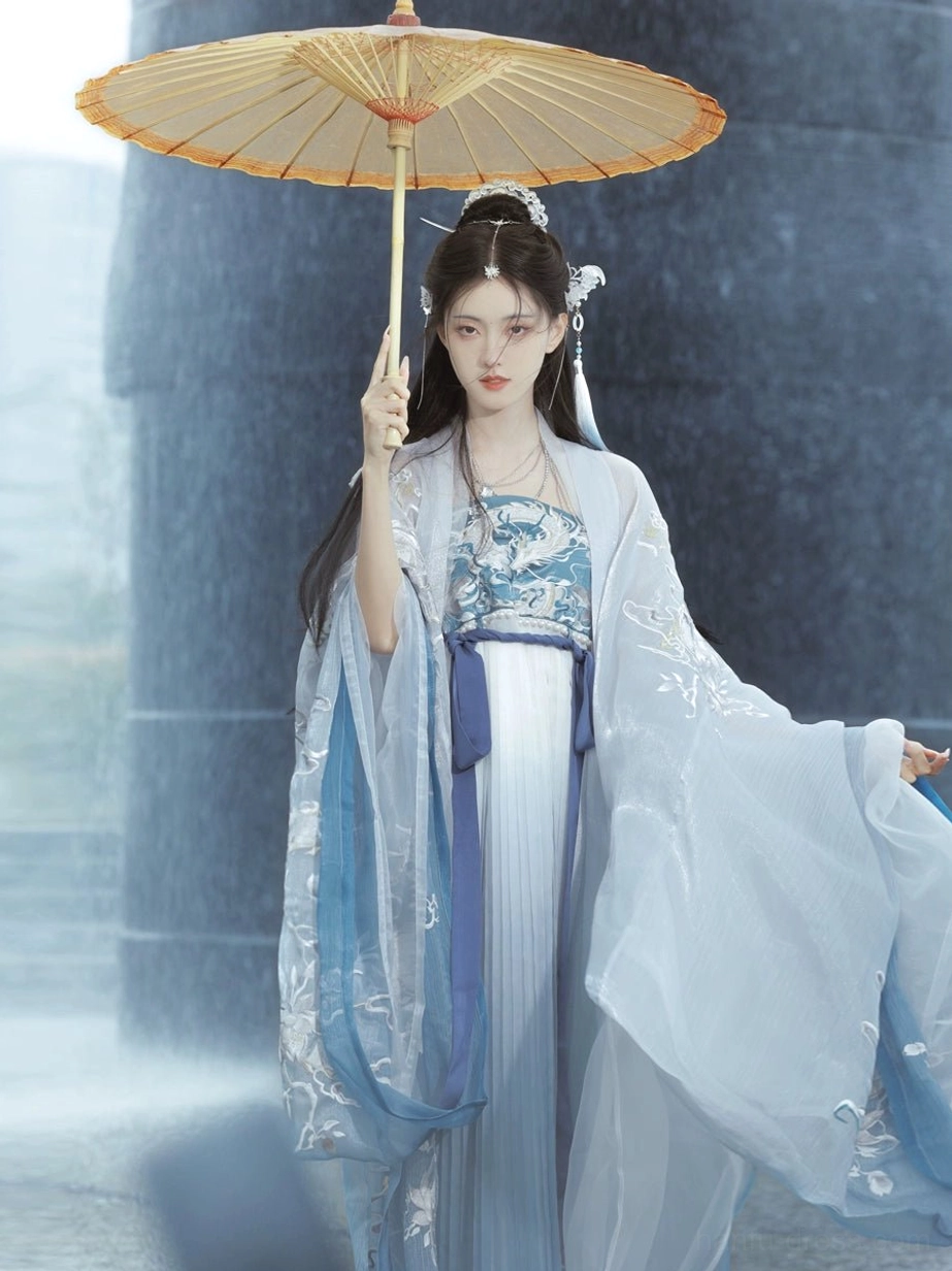 Front view of Dragon Queen blue Tang Dynasty Hanfu heziqun with matching waist sash, embroidered robe, and flowing white blue layers