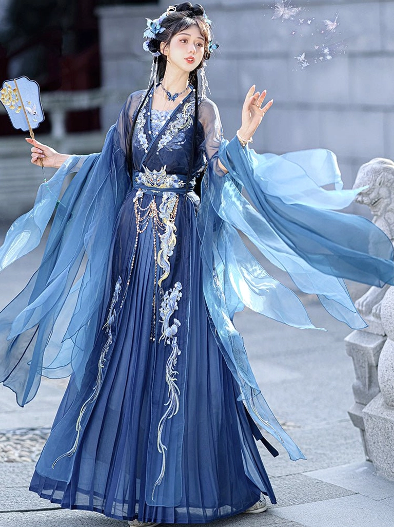Chinese fantasy Hanfu full set shown from a three-quarter front view with flowing blue sleeves, embroidered floral and wave skirt, sheer camisole, and gemstone necklace