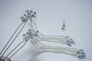 Pair of Dream of Seas traditional Chinese Hanfu hairpins with blue crystal flowers and layered silver tassels