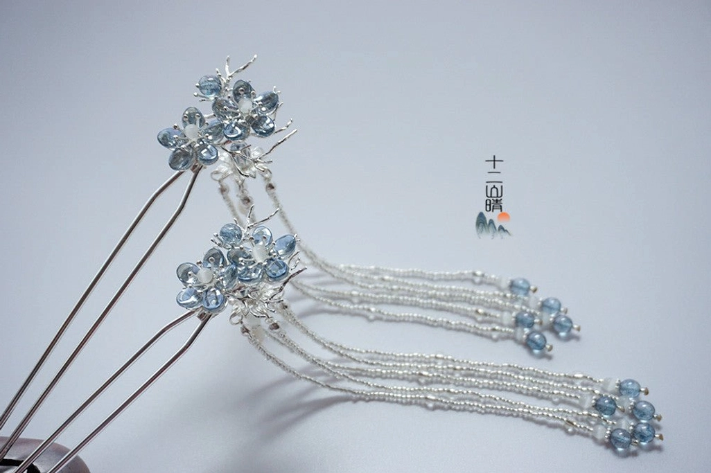 Pair of Dream of Seas traditional Chinese Hanfu hairpins with blue crystal flowers and layered silver tassels