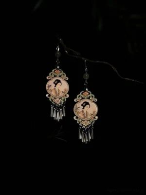 Front view of Dream of Red Mansions Chinese tassel earrings with classical maiden portrait medallions and green beads