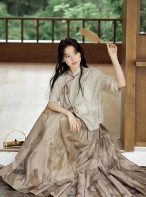 Full body view of a modern Ming Dynasty inspired Hanfu two piece set with beige jacquard cropped top and taupe printed mamian skirt