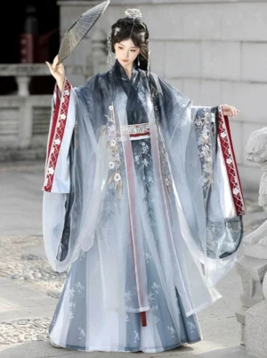 Dream Walking Wei Jin style Qiyao Hanfu with blue and ivory gradient robe, high-waisted wrap skirt, floral embroidery, red patterned sleeve trim, and a female model holding a palm leaf fan