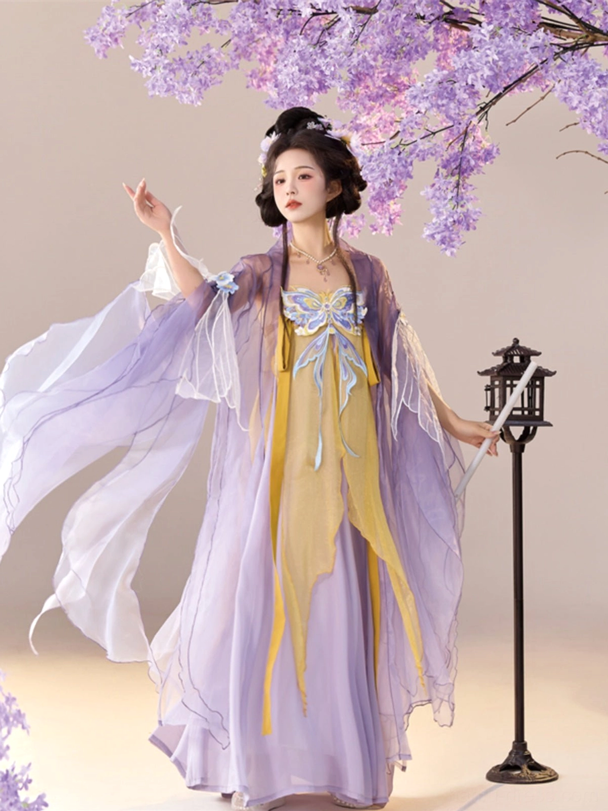 Tang Dynasty style Qixiong Ruqun Hanfu three quarter view showing flowing lavender sheer sleeves and butterfly embroidered golden dress