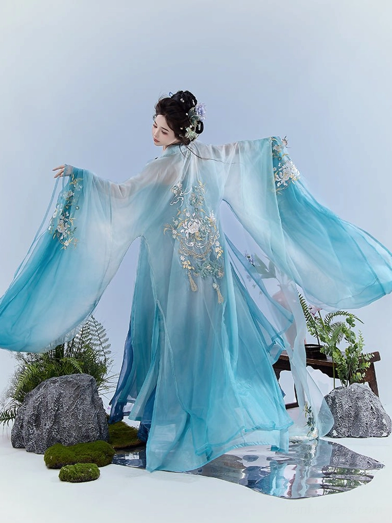 Back view of blue gradient Tang Dynasty Heziqun Hanfu with oversized wide sleeves, silver floral embroidery, and long train