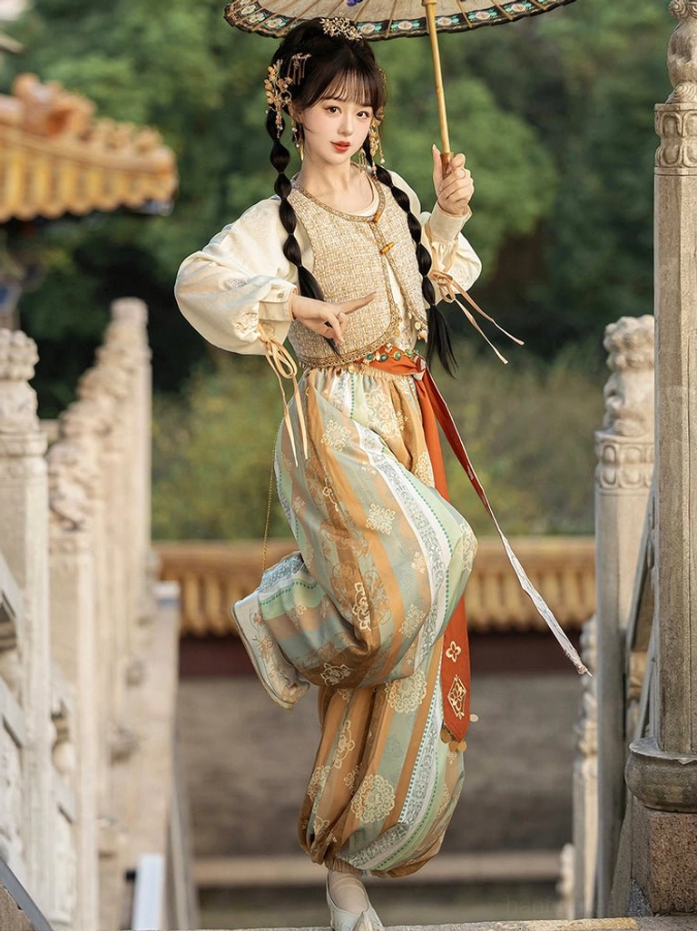 Dunhuang Feitian inspired Tang Dynasty Hanfu costume in a dynamic pose with flowing printed bloomers and traditional oil-paper umbrella
