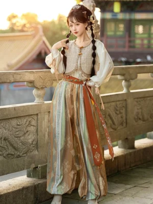 Dunhuang Feitian Tang Dynasty Hanfu set shown in a three-quarter front view with cream lantern sleeves beige vest terracotta waist sash and printed bloomers