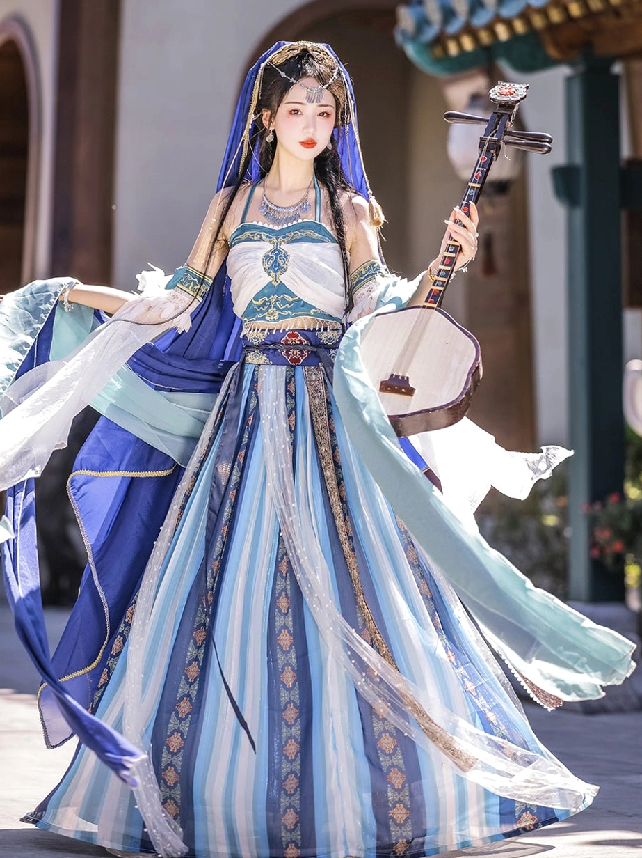 Front full-body view of blue and cyan Dunhuang Feitian Tang Dynasty princess Hanfu costume with striped pleated skirt, embroidered waist trim, flowing veil, ribbon sleeves, and traditional ruan lute in an ancient Chinese courtyard