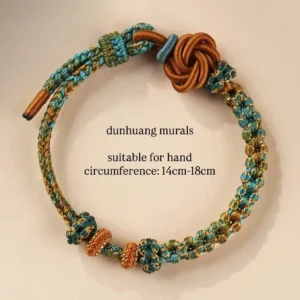Dunhuang-inspired handwoven Chinese knot bracelet displayed on a light background, featuring teal, bronze brown, and gold-toned threads, a flower-shaped knot closure, and adjustable loop fastening for 14 to 18 cm wrists