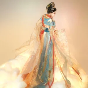 Side view of a Dunhuang-inspired Tang Dynasty Hanfu costume showing layered sheer fabric, flowing skirt train, color-blocked upper garment, and gold decorative details