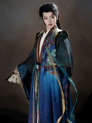 Three-quarter view of a male Dunhuang-inspired Xianxia Hanfu costume showing the flowing blue robe, layered front panels, wide sleeves, waist decorations, and fantasy character styling