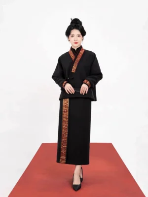 Full-body view of a black Dunhuang scroll motif Tang Dynasty Hanfu jacket and high-waisted long skirt outfit with warm brown embroidered trim