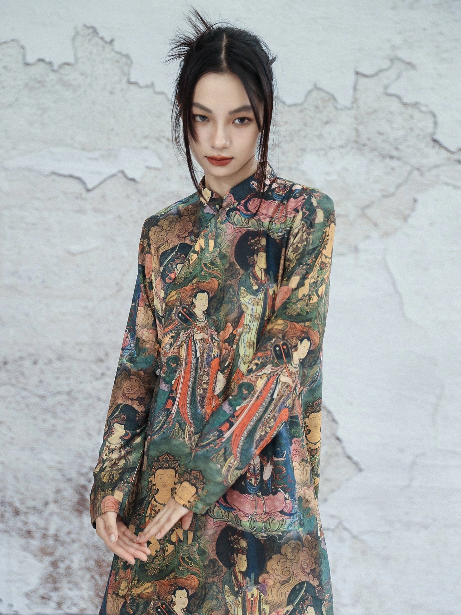 Upper body front view of Dunhuang themed modern Hanfu dress showing long sleeves stand collar and all-over mural art print