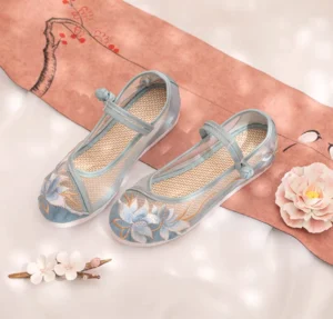 Dusty blue lotus embroidered traditional Chinese Hanfu shoes with gold thread toe design, mesh upper, Chinese knot buckle strap, and woven insole